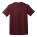 A Port & Company maroon short sleeve t-shirt.