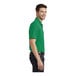 A man wearing a bright kelly green Port Authority Dry Zone short sleeve polo shirt.