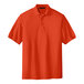 A Port Authority® orange polo shirt.