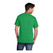 A man wearing a Port & Company clover green short sleeve t-shirt.