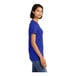 A woman wearing a District deep royal blue combed ring-spun cotton t-shirt.