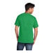 A man wearing a Port & Company clover green short sleeve T-shirt.