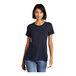 A woman wearing a District navy blue short sleeve t-shirt.