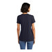 A woman wearing a District navy short sleeve t-shirt.