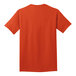 The back of an orange Port & Company short sleeve t-shirt.