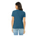 A woman wearing a Bella + Canvas heather deep teal short sleeve t-shirt.