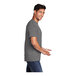 A man in a Port & Company medium gray short sleeve t-shirt smiling.