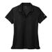 A black Nike polo shirt with a white swoosh on it.