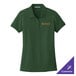 A medium women's deep forest green Port Authority polo shirt with a logo on it.