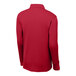 A medium deep red Sport-Tek long sleeve polo shirt.