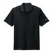 A black Nike Dri-Fit polo with a white swoosh on the sleeve.