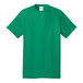 A green Port & Company short sleeve t-shirt with a white label.