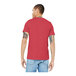 A man wearing a heather red Bella + Canvas customizable T-shirt.