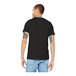 A man wearing a Bella + Canvas black heather customizable t-shirt.