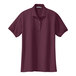 A Port Authority maroon polo shirt for women with short sleeves.