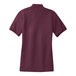 A maroon Port Authority ladies' polo shirt with a close-up of the fabric texture.