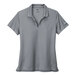 A grey Nike women's polo shirt with a white swoosh.
