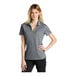A woman wearing a grey Nike short sleeve polo shirt.