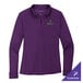 A Port Authority women's bright purple long sleeve polo shirt.