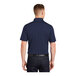A man wearing a navy Sport-Tek short sleeve polo shirt.