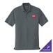 A graphite Port Authority polo shirt with a red cross logo on the chest.