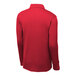 A red Sport-Tek long sleeve polo shirt on a mannequin.