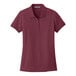 A Port Authority women's burgundy polo shirt.