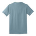 A back view of a stonewashed blue Port & Company T-shirt.