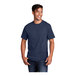 A man wearing a navy Port & Company T-shirt.