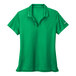 A green Nike Dri-Fit polo with a white swoosh.