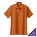 A small Texas orange Port Authority polo shirt with a logo on it.