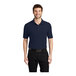 A man wearing a navy Port Authority® silk touch polo shirt.