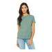 A woman wearing a Bella + Canvas heather prism dusty blue short sleeve t-shirt.