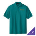 A medium teal Port Authority polo shirt with a logo on it.