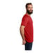 A man with a beard wearing a red AllMade Rise-Up t-shirt.