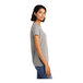 A woman wearing a light heather gray District short sleeve t-shirt.