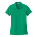 A Port Authority women's bright kelly green polo shirt.