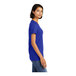 A woman wearing a District deep royal blue combed cotton t-shirt.