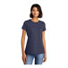 A woman wearing a heathered navy blue District scoop neck t-shirt.