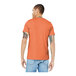 A man wearing a Bella + Canvas heather orange t-shirt.