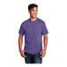 A man wearing a Port & Company heather purple premium cotton t-shirt.