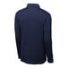 A back view of a Sport-Tek True Navy long sleeve polo shirt on a mannequin.