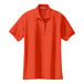 An orange Port Authority silk touch polo shirt with a collar and buttons.