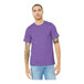 A man wearing a Bella + Canvas heather team purple t-shirt.