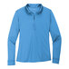 A Port Authority women's long sleeve Carolina Blue polo shirt.