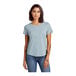 A woman wearing a light blue AllMade scoop neck t-shirt.