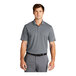 A man wearing a Nike dri-fit cool grey polo shirt with a collar.