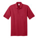 A Port & Company red short sleeve polo shirt.
