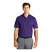 A man wearing a Nike purple polo shirt.