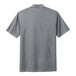 A Nike cool grey short sleeve polo shirt with a collar.